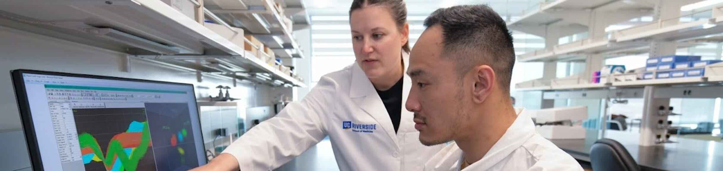 Dr. Natalie Zlebnik with a graduate student in her lab