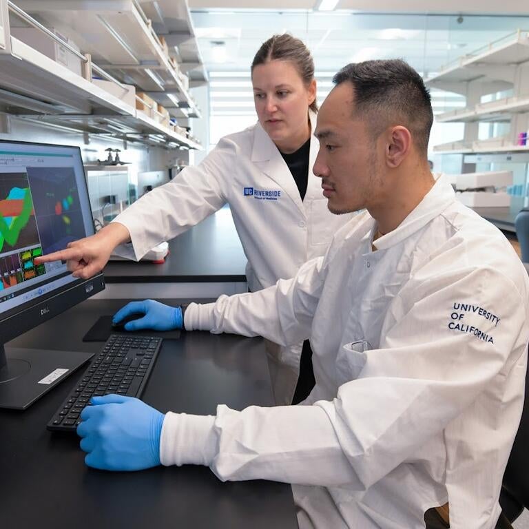 Dr. Natalie Zlebnik with a graduate student in her lab