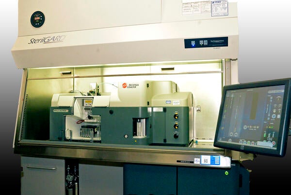 Image of the Beckman Colter instrument in a fume hood